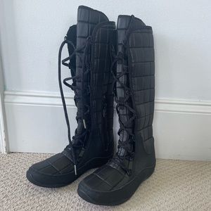 Black Quilted North Face Winter Boots with Plush Interior and Red Details